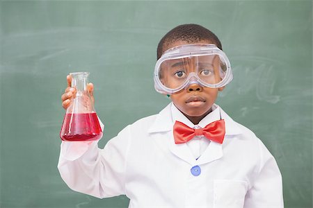 Sad pupil holding at a red liquid at elementary school Stock Photo - Budget Royalty-Free & Subscription, Code: 400-07991042