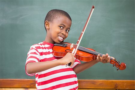 simsearch:400-07991158,k - Happy pupil playing violin in classroom at the elementary school Stock Photo - Budget Royalty-Free & Subscription, Code: 400-07991068