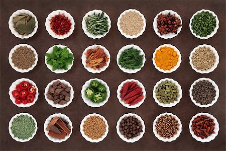 Large herb and spice collection in porcelain crinkle bowls over lokta paper background. Stock Photo - Budget Royalty-Free & Subscription, Code: 400-07993028