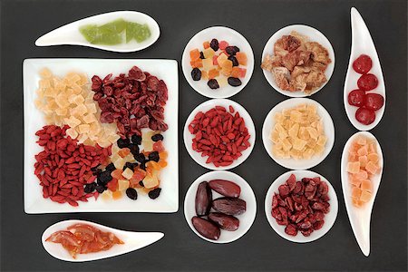 simsearch:400-07510855,k - Healthy dried fruit selection in white porcelain bowls over slate background. Photographie de stock - Aubaine LD & Abonnement, Code: 400-07993057