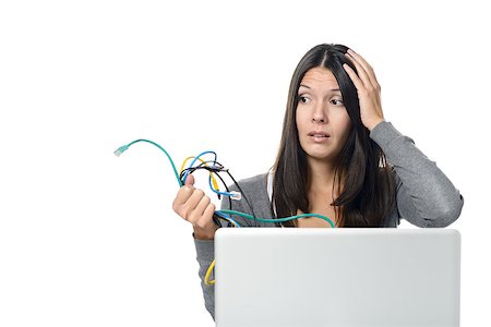 desconectar - Close up of Upset Woman in Gray Long Sleeve Shirt holding Tangled Network Cables in Her Hand While Experiencing computer problems, Isolated on White Background. Foto de stock - Royalty-Free Super Valor e Assinatura, Número: 400-07993081