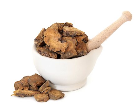 simsearch:400-06521200,k - Rhubarb root herb used in chinese herbal medicine in a stone mortar with pestle over white background. Da huang. Rheum palmatum. Stockbilder - Microstock & Abonnement, Bildnummer: 400-07993097