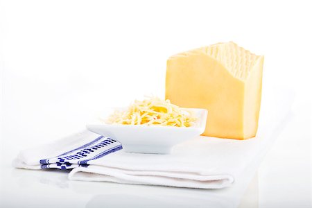 edam - Grated cheese in white bowl and big gouda piece isolated on white. Stock Photo - Budget Royalty-Free & Subscription, Code: 400-07993459