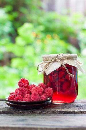 Raspberry preserve in glass jar and fresh raspberries on a plate Stock Photo - Budget Royalty-Free & Subscription, Code: 400-07993573