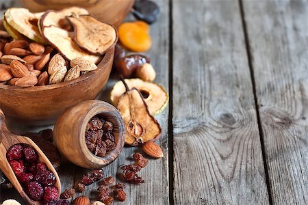 simsearch:400-07310170,k - Mix of dried fruits and almonds - symbols of judaic holiday Tu Bishvat. Copyspace background. Fotografie stock - Microstock e Abbonamento, Codice: 400-07993615