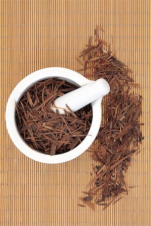 Pau d'arco herb in a mortar with pestle and loose over bamboo background. Tabebuia impresiginosa. Stock Photo - Budget Royalty-Free & Subscription, Code: 400-07993730