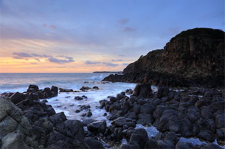 simsearch:400-07667033,k - Sunrise skies  of soft pretty colours at bottom of the Minamurra volcanic landscape cliffs at low tide Stock Photo - Budget Royalty-Free & Subscription, Code: 400-07993882