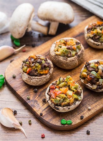 Portobello mushrooms stuffed with tomato, paprika, and mozzarella cheese. Stock Photo - Budget Royalty-Free & Subscription, Code: 400-07993914