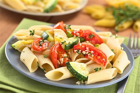 rigate - Vegetarian penne pasta dish with baked zucchini and tomato spiced with thyme and garlic (Selective Focus, Focus one third into the dish) Stock Photo - Budget Royalty-Free & Subscription, Code: 400-08015488
