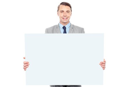 simsearch:400-06695536,k - Business representative holding white billboard in front of camera Stock Photo - Budget Royalty-Free & Subscription, Code: 400-08015602