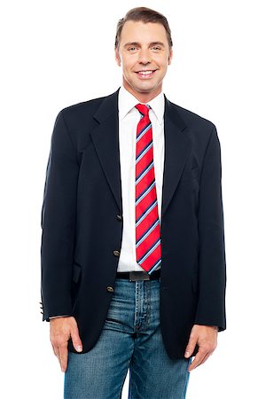 Smiling young businessperson posing casually over white background Stock Photo - Budget Royalty-Free & Subscription, Code: 400-08015616