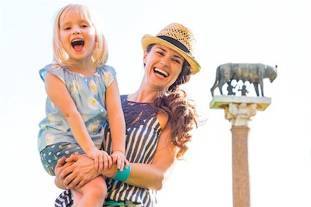 simsearch:400-08016330,k - Portrait of happy mother and baby girl in front of capitoline wolf, pisa, tuscany, italy Stock Photo - Budget Royalty-Free & Subscription, Code: 400-08015831