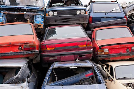 scrap yard pile of cars - Piled up destroyed cars in the junkyard. Stock Photo - Budget Royalty-Free & Subscription, Code: 400-08016210