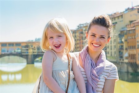 simsearch:400-08020855,k - Portrait of happy mother and baby girl standing on bridge overlooking ponte vecchio in florence, italy Stockbilder - Microstock & Abonnement, Bildnummer: 400-08016320