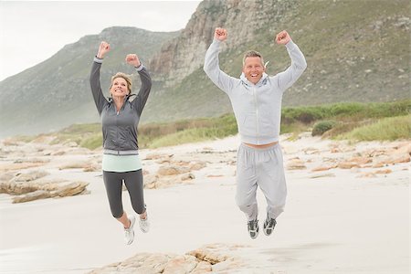 fitness   mature woman - Fit couple smiling at camera at the beach Stock Photo - Budget Royalty-Free & Subscription, Code: 400-08017251