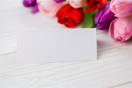 simsearch:400-06877837,k - Colorful tulips and white card on wooden table Stock Photo - Budget Royalty-Free & Subscription, Code: 400-08017465