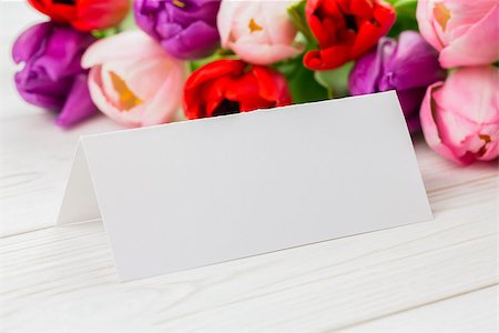 simsearch:400-06877837,k - Close up of colorful tulips and white card on wooden table Stock Photo - Budget Royalty-Free & Subscription, Code: 400-08017466