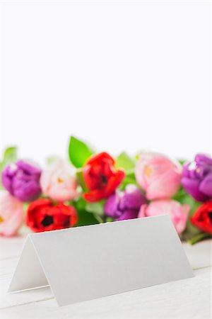 simsearch:400-06877837,k - Colorful tulips and white card on wooden table Stock Photo - Budget Royalty-Free & Subscription, Code: 400-08017469