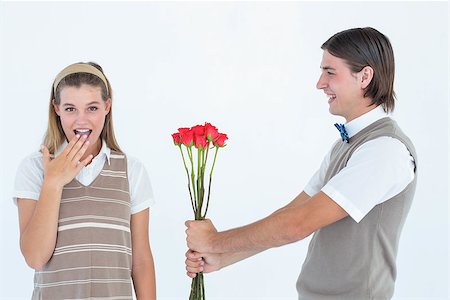 simsearch:400-04655735,k - Geeky hipster offering red roses to his girlfriend on white background Stockbilder - Microstock & Abonnement, Bildnummer: 400-08017560
