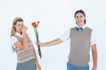 simsearch:400-04655736,k - Geeky hipster offering red roses to his girlfriend on white background Stockbilder - Microstock & Abonnement, Bildnummer: 400-08017561