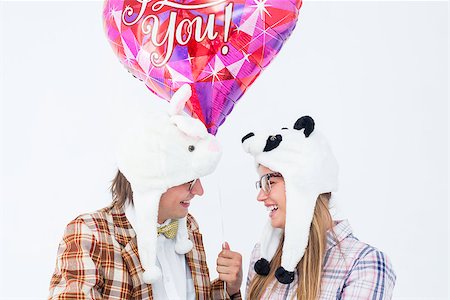 simsearch:400-07686530,k - Geeky hipster in love couple looking at each other on white background Foto de stock - Royalty-Free Super Valor e Assinatura, Número: 400-08017618