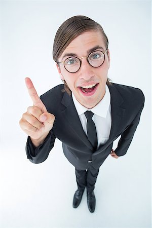 simsearch:400-04861869,k - Geeky businessman pointing up on white background Foto de stock - Royalty-Free Super Valor e Assinatura, Número: 400-08017638