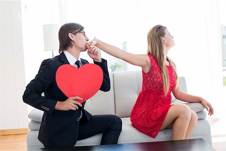 simsearch:400-07686530,k - Cute geeky couple with red heart shape on the couch Foto de stock - Royalty-Free Super Valor e Assinatura, Número: 400-08017664