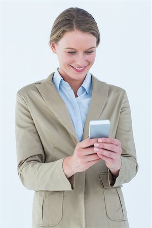 simsearch:400-07141016,k - Businesswoman using her mobile phone on white background Stockbilder - Microstock & Abonnement, Bildnummer: 400-08017911