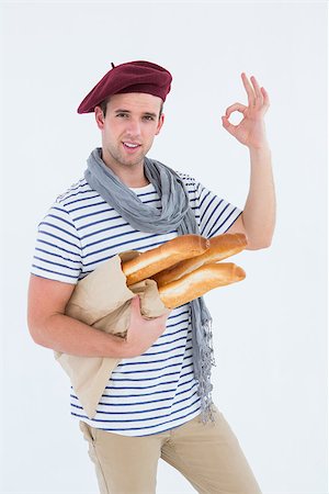 french lifestyle and culture - French guy with beret holding baguettes on white background Stock Photo - Budget Royalty-Free & Subscription, Code: 400-08018023