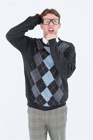 simsearch:400-07778671,k - Geeky hipster frowning at camera on white background Fotografie stock - Microstock e Abbonamento, Codice: 400-08018041