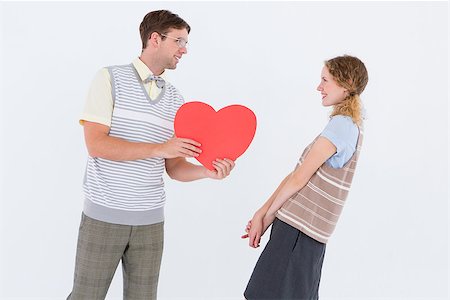 simsearch:400-08380794,k - Geeky hipster giving heart card to his girlfriend on white background Stockbilder - Microstock & Abonnement, Bildnummer: 400-08018052