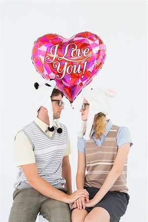 simsearch:400-08380794,k - Geeky hipster couple looking to each other on white background Stockbilder - Microstock & Abonnement, Bildnummer: 400-08018078