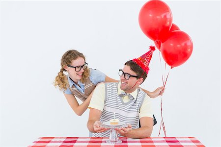 simsearch:400-08380794,k - Geeky hipster couple celebrating his birthday on white background Stockbilder - Microstock & Abonnement, Bildnummer: 400-08018071