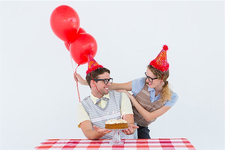 simsearch:400-08380794,k - Geeky hipster couple celebrating his birthday on white background Stockbilder - Microstock & Abonnement, Bildnummer: 400-08018073