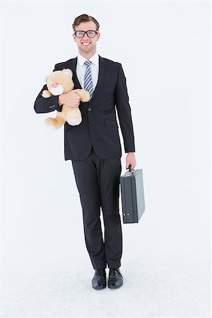 simsearch:400-08020381,k - Geeky hipster businessman holding briefcase and teddy on white background Fotografie stock - Microstock e Abbonamento, Codice: 400-08018087