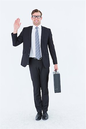 Geeky hipster businessman waving at camera on white background Stock Photo - Budget Royalty-Free & Subscription, Code: 400-08018088