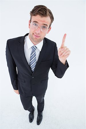 simsearch:400-04861869,k - Geeky businessman with finger up on white background Foto de stock - Royalty-Free Super Valor e Assinatura, Número: 400-08018094