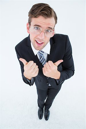 simsearch:400-04861869,k - Geeky businessman with thumbs up on white background Foto de stock - Royalty-Free Super Valor e Assinatura, Número: 400-08018096