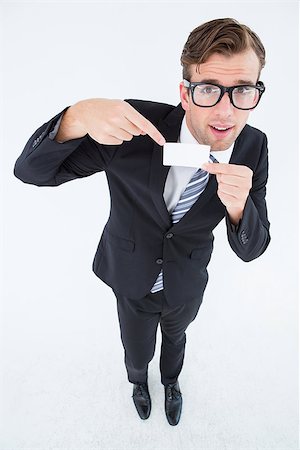 simsearch:400-08020381,k - Geeky hipster businessman holding card on white background Fotografie stock - Microstock e Abbonamento, Codice: 400-08018092