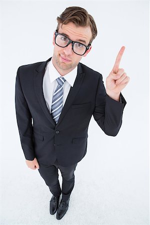 simsearch:400-08020381,k - Geeky hipster businessman with finger up on white background Fotografie stock - Microstock e Abbonamento, Codice: 400-08018093