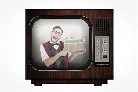 simsearch:400-08380794,k - Geeky hipster holding a retro radio against retro tv Stockbilder - Microstock & Abonnement, Bildnummer: 400-08019247