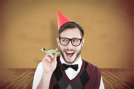 simsearch:400-08380794,k - Geeky hipster in party hat with horn against yellow background with vignette Stockbilder - Microstock & Abonnement, Bildnummer: 400-08019261