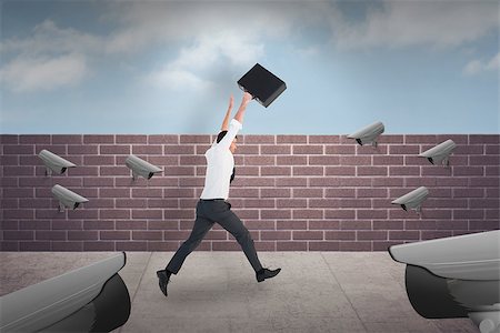 simsearch:6111-06838348,k - Businessman leaping with his briefcase against blue sky over a brick wall Stock Photo - Budget Royalty-Free & Subscription, Code: 400-08019446