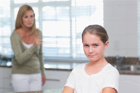 simsearch:400-06553851,k - Sulking little having an argument with her mother at home in the kitchen Foto de stock - Super Valor sin royalties y Suscripción, Código: 400-08019685