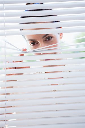 Woman peeking through blinds from outside Stock Photo - Budget Royalty-Free & Subscription, Code: 400-08019958