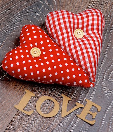 simsearch:400-07954156,k - Cardboard Word Love and Two Handmade Textile Red Polka Dot Hearts closeup on Hardwood background Foto de stock - Royalty-Free Super Valor e Assinatura, Número: 400-08011122