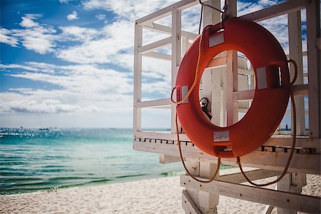 Lifebuoy on the beach, a tropical coastline Stock Photo - Budget Royalty-Free & Subscription, Code: 400-08011623