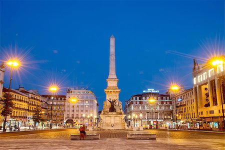 simsearch:400-07326929,k - Square at night in the center of the city. Romantic Lisbon street with the typical old buildings and new buildings Foto de stock - Royalty-Free Super Valor e Assinatura, Número: 400-08012173