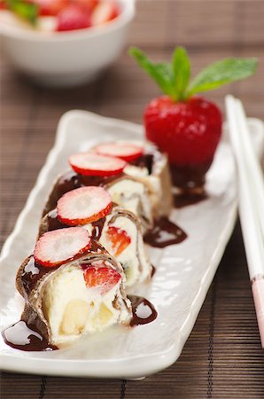 sushi dessert - sweet rolls with strawberry and banana chocolate drenched Stock Photo - Budget Royalty-Free & Subscription, Code: 400-08012820