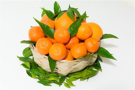 A big orange basket with leaf in white background Stock Photo - Budget Royalty-Free & Subscription, Code: 400-08013038